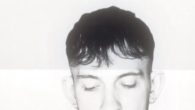 A choppy fringe with shaved sides, black and white