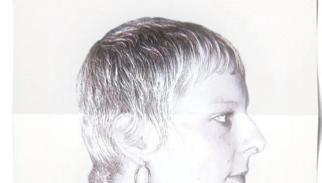 A short textured crop with a curved fringe, black and white