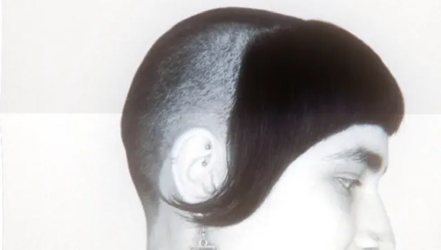 A sculpted bowl shape over a shaved side, black and white
